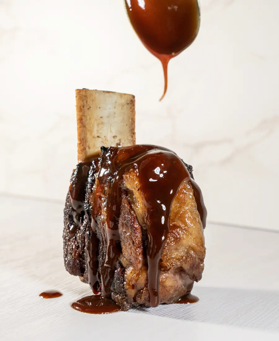 Costilla de ternera confitada preparación